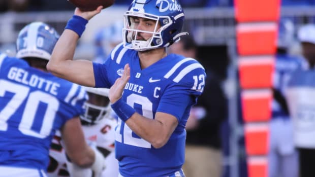 Nov 27, 2021; Durham, North Carolina, USA; Duke Blue Devils quarterback Gunnar Holmberg (12) with the ball during the second half of the game against the Miami Hurricanes at Wallace Wade Stadium. at Wallace Wade Stadium. Mandatory Credit: Jaylynn Nash-USA TODAY Sports